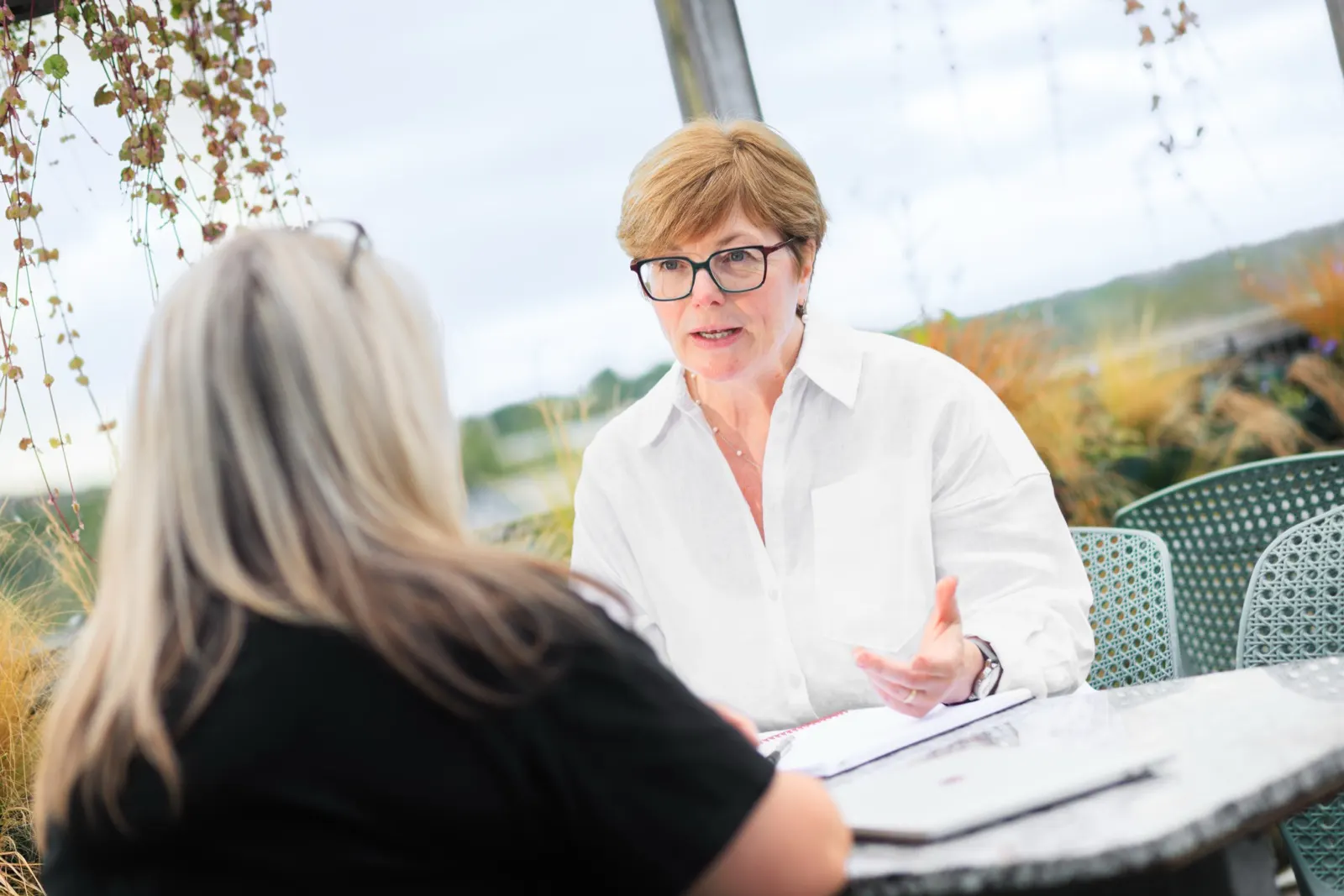 Joanne Dolezal in conversation with a client on the Toffee Factory roof terrace