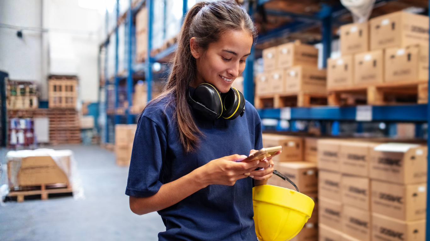 Woman using app in warehouse